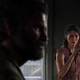 Tess looks at Joel while taking a sip from a glass in leaked images of The Last Of Us Part I.